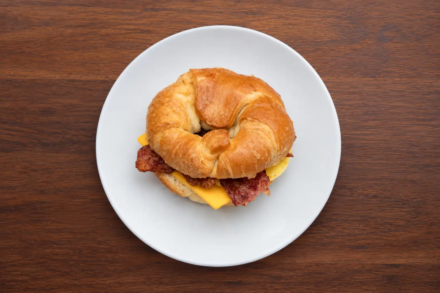 Croissant with Turkey Bacon, Egg, and American Cheese